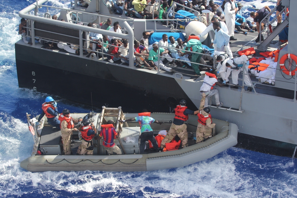 MEDITERRANEAN SEA (Oct. 17, 2013) Distressed persons are transferred from the amphibious transport dock ship USS San Antonio (LPD 17) to Armed Forces of Malta offshore patrol vessel P52. San Antonio provided food, water, medical attention, and temporary shelter to the rescued. San Antonio rescued 128 men adrift in an inflatable raft after responding to a call by the Maltese Government. (U.S. Navy photo/Released) 131017-N-ZZ999-009 Join the conversation http://www.navy.mil/viewGallery.asp http://www.facebook.com/USNavy http://www.twitter.com/USNavy http://navylive.dodlive.mil http://pinterest.com https://plus.google.com